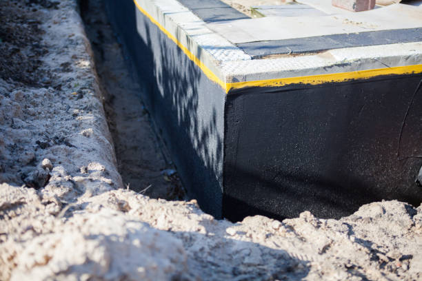 Professional Waterproofing technician working in Gwynneville, IN